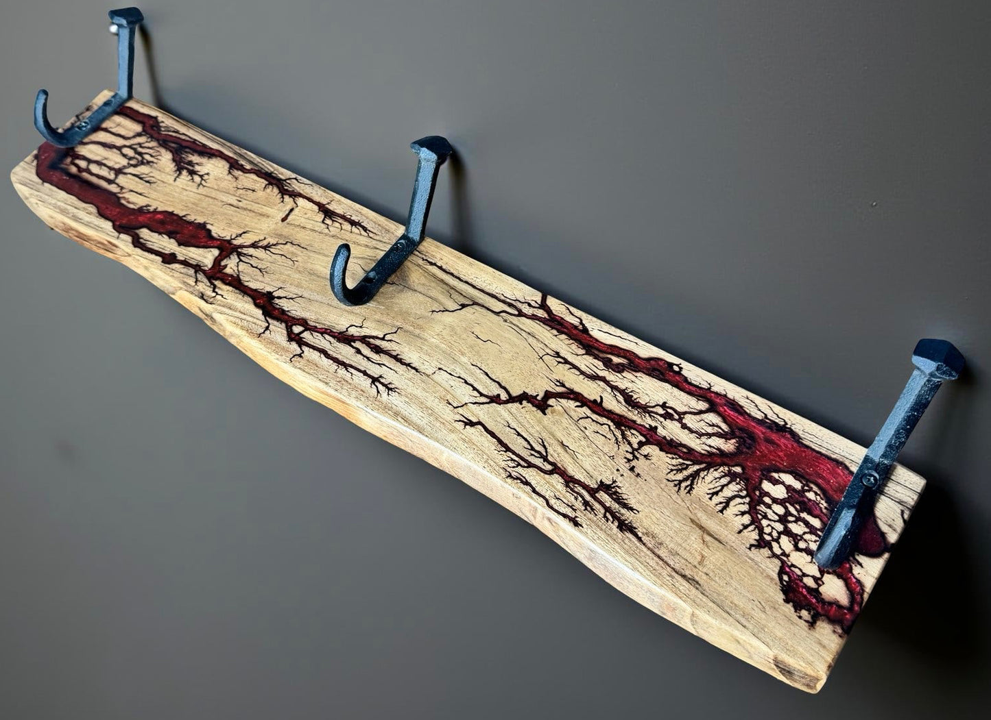 Red resin coat rack with electrifying grain highlights, premium Australian made