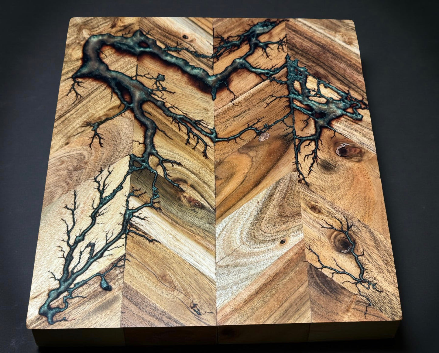 Premium 320 x 320 square chopping board with red green chameleon resin design and natural fractal burning texture produced in Bairnsdale Australia handmade by Fractal Flow Designs Australia’s resin board brand