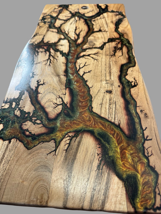 Close up of gold green red chameleon resin detail on live edge charcuterie board fractal burning design by Fractal Flow Designs East Gippsland Australia
