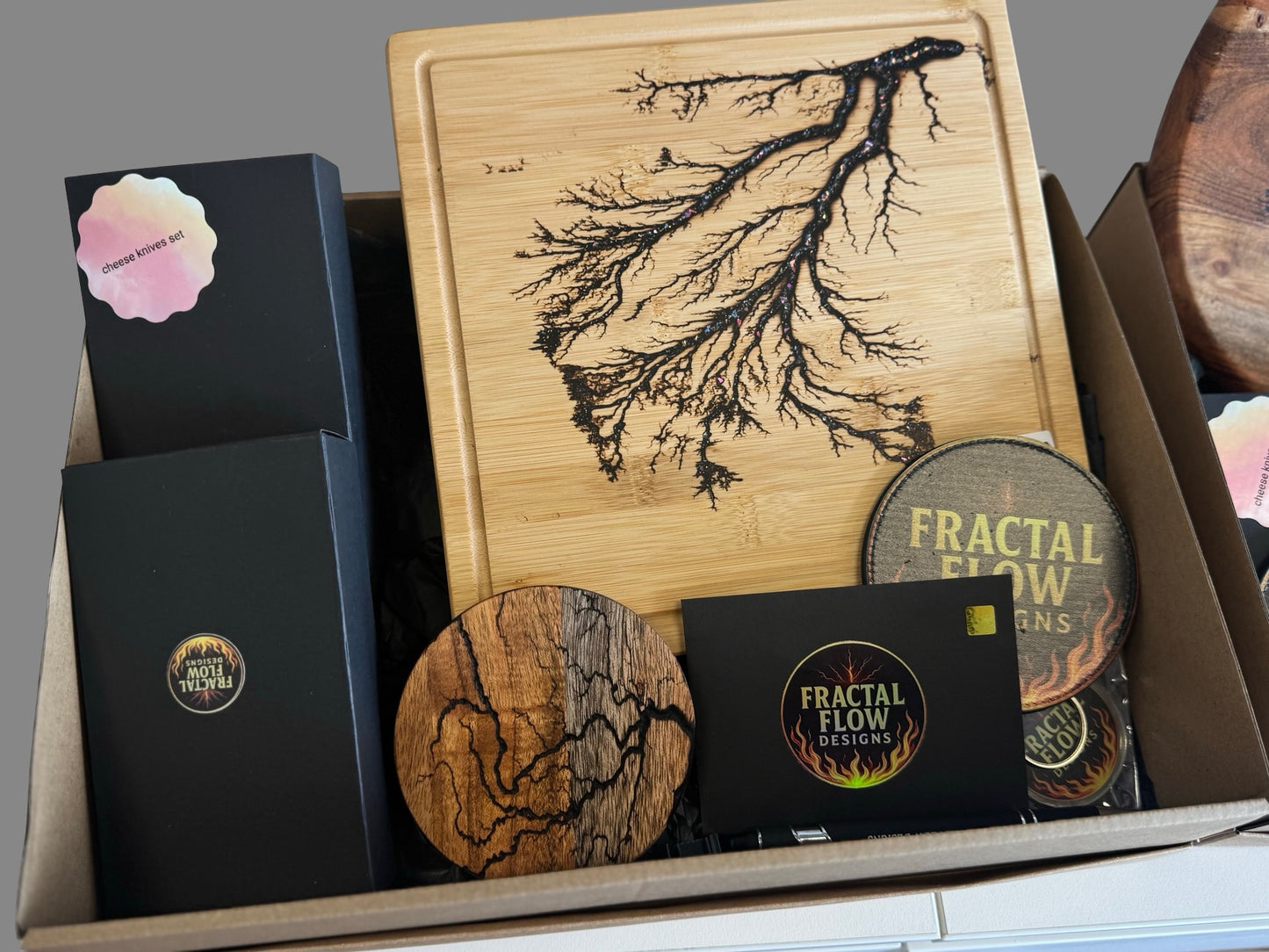 Deluxe cheese lovers set with resin board, forged cheese knife, care kit, and accessories, handcrafted by Fractal Flow Designs, a standout Australian gift idea.