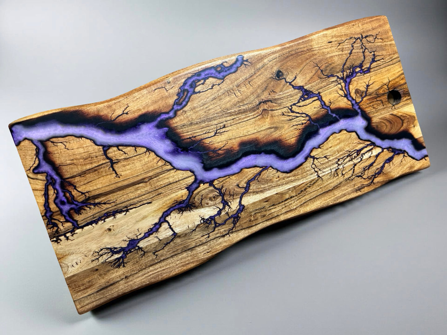 Purple iridescent resin live edge timber board featuring lightning burn art, artisan grazing piece