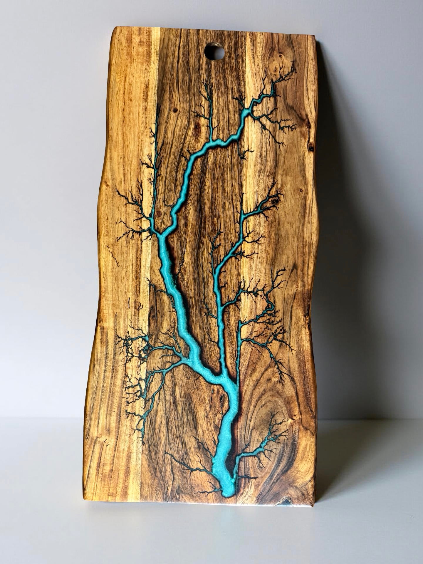 Iridescent green live edge serving board with lightning strike burn pattern, handcrafted Australian timber