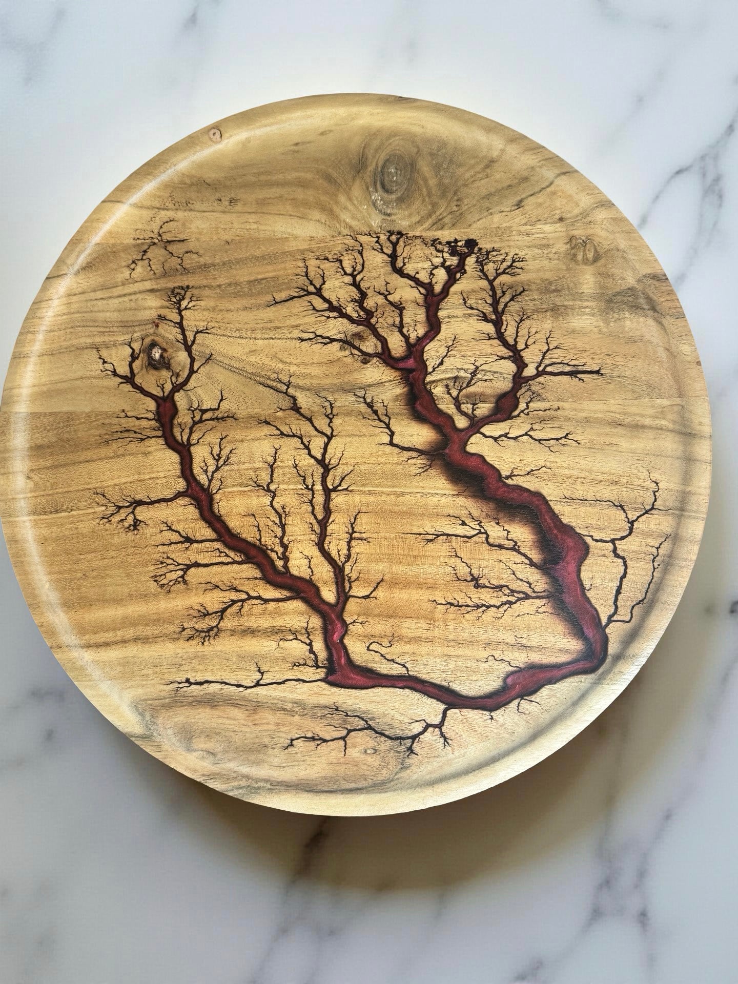 Red round resin board in motion Australia resin art East Gippsland premium vibe