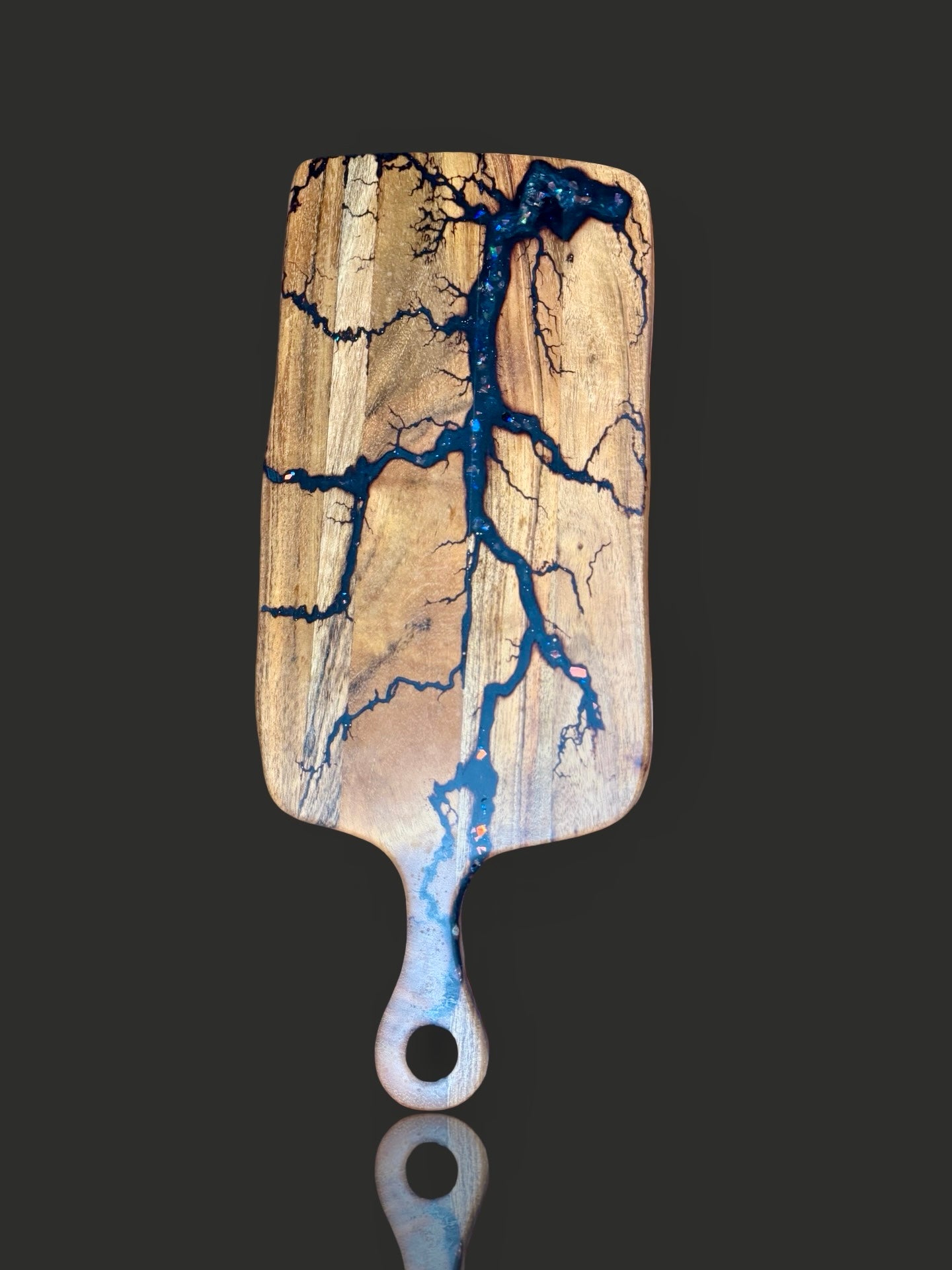 High quality resin cheese paddle board, handcrafted from Australian harwood timber. Fractal Flow Designs creates artisan serving boards perfect for charcuterie spreads and platters 