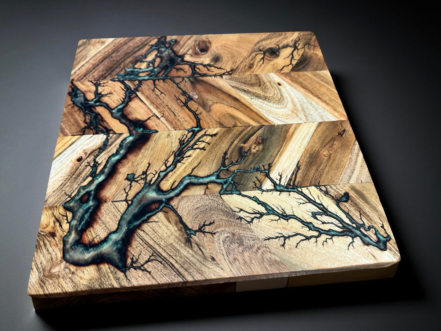 Australian hardwood chopping board 320 x 320 combining red green chameleon resin tones with lightning style fractal burning art created in Bairnsdale Australia by Fractal Flow Designs Australia’s resin board brand