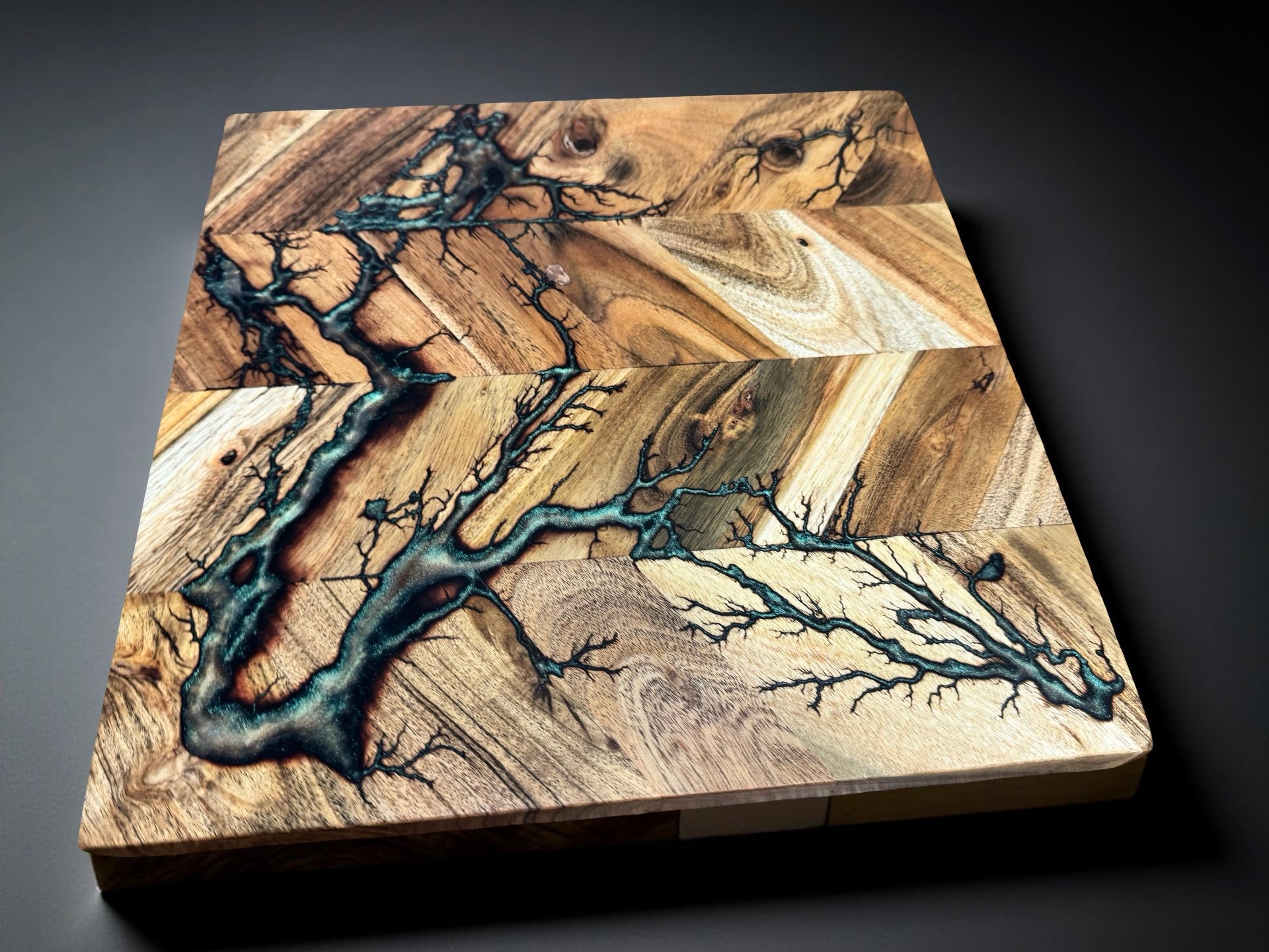 Australian hardwood chopping board 320 x 320 combining red green chameleon resin tones with lightning style fractal burning art created in Bairnsdale Australia by Fractal Flow Designs Australia’s resin board brand