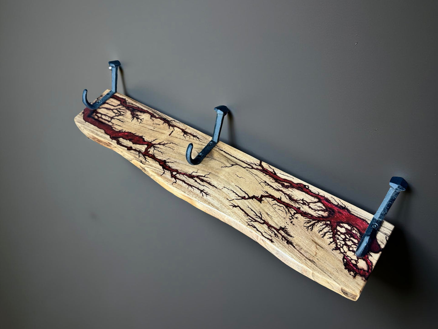 Red resin coat rack with electrifying grain highlights, premium Australian made
