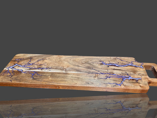 Fractal Flow Designs charcuterie board – handcrafted from premium Australian hardwood with striking resin inlays and fractal burning. A luxury artisan serving platter for cheese, grazing, and entertaining. Perfect Australian-made gift for weddings, anniversaries, birthdays, housewarmings, and corporate events. Unique timber resin board, made in Bairnsdale Victoria.