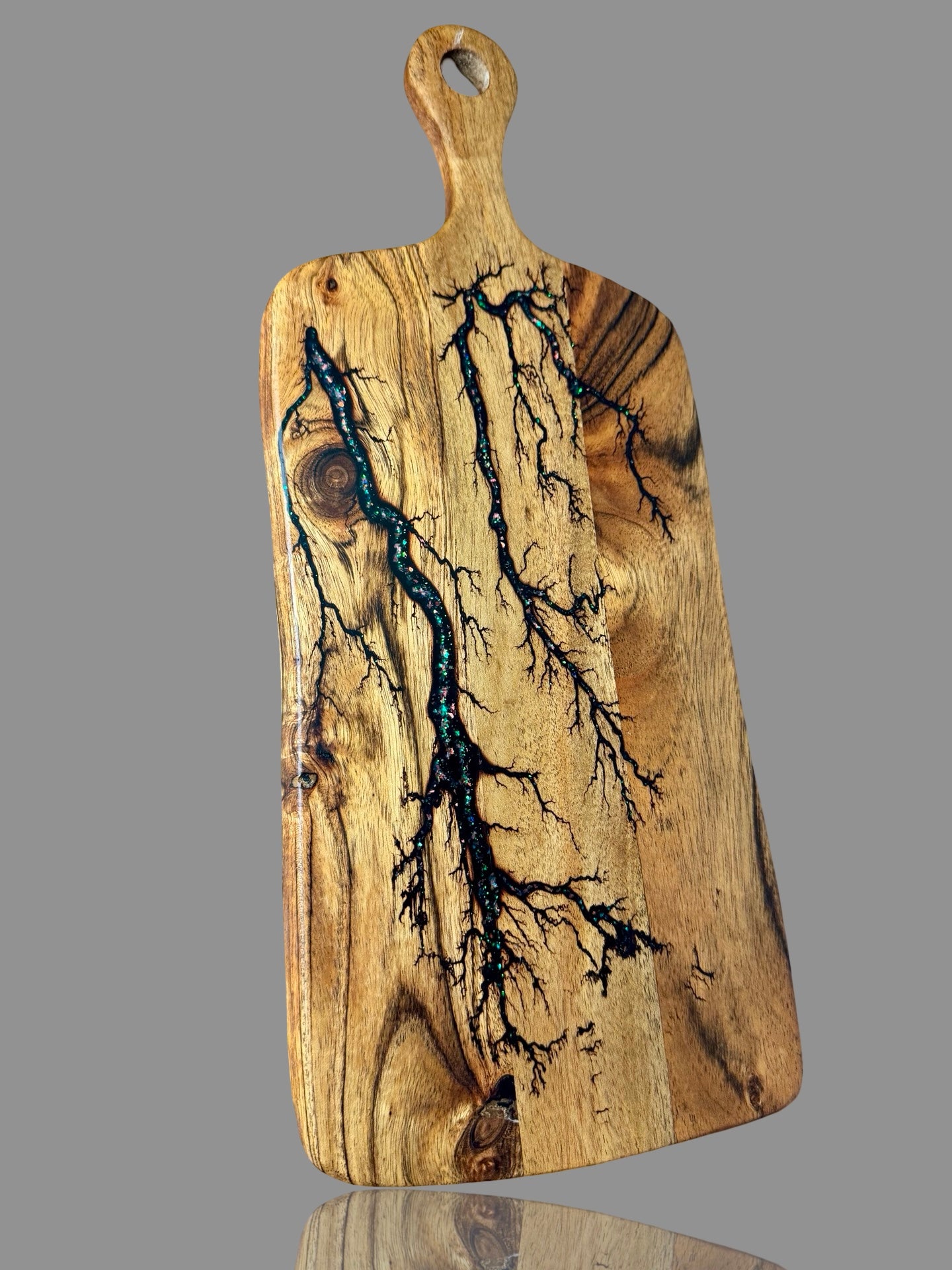 Elegant timber and resin paddle cheese board, handcrafted by Fractal Flow Designs in Victoria, Australia