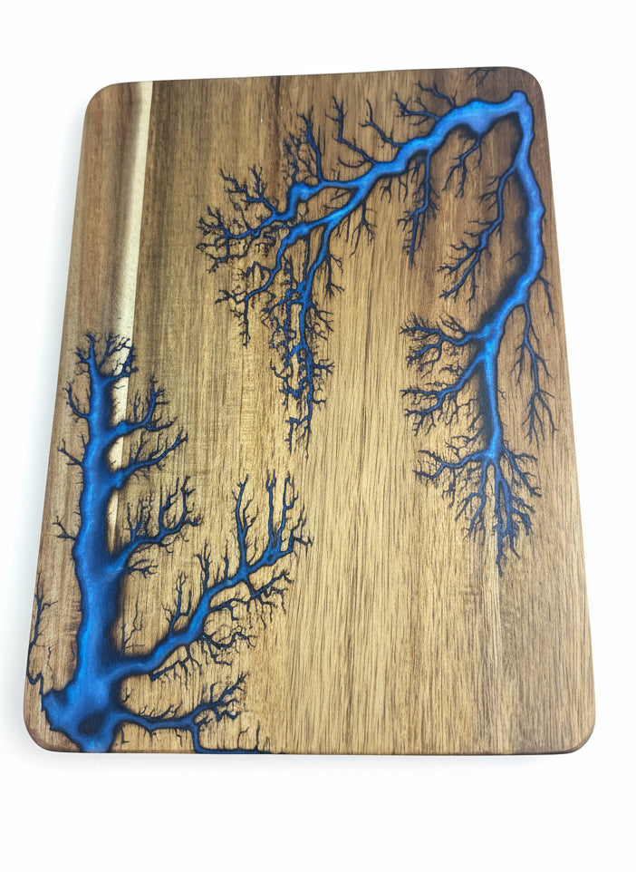 Handmade acacia wood and blue resin chopping board from Bairnsdale, Victoria. Australian-made by Fractal Flow Designs with unique resin design and artisan craftsmanship