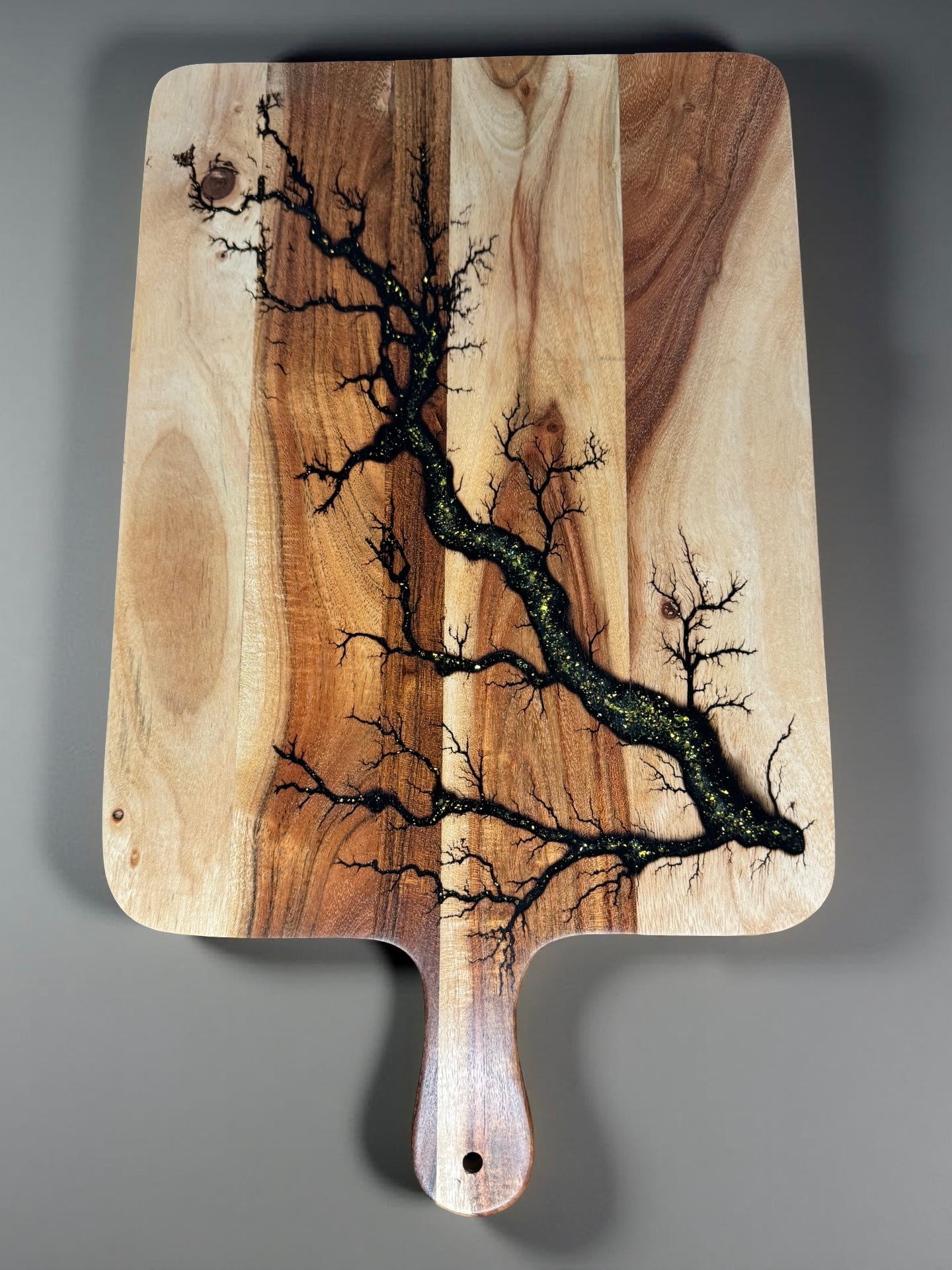 Gold sparkle resin cheese paddle board handcrafted from sustainable Australian timber by Fractal Flow Designs