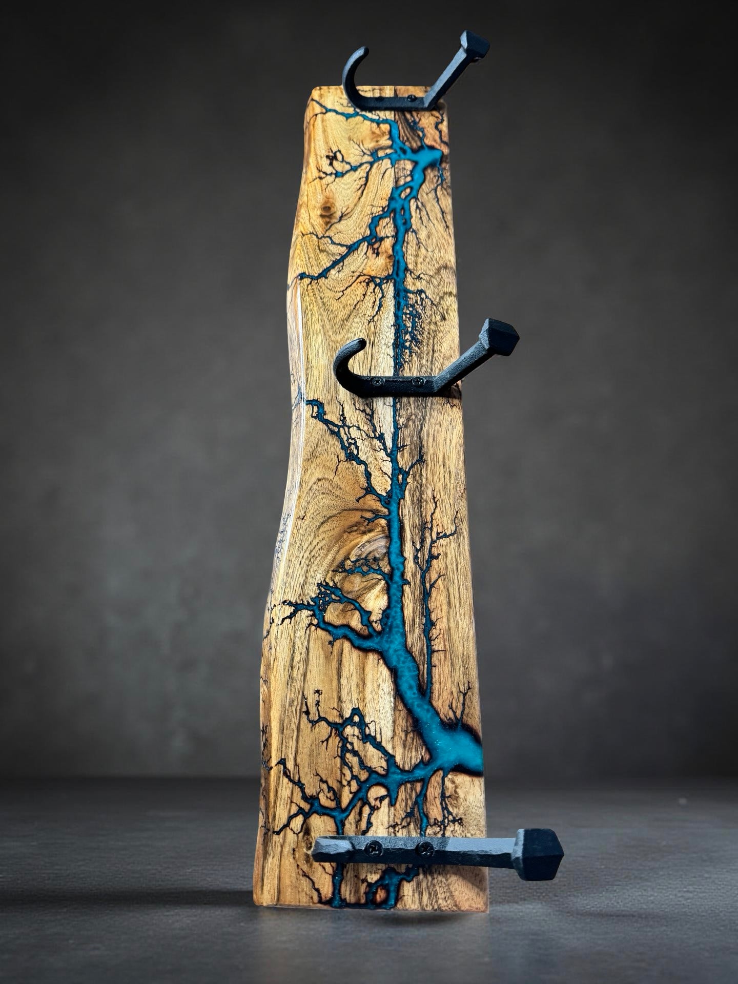 Resin timber coat rack with sleek hooks, handcrafted artisan design