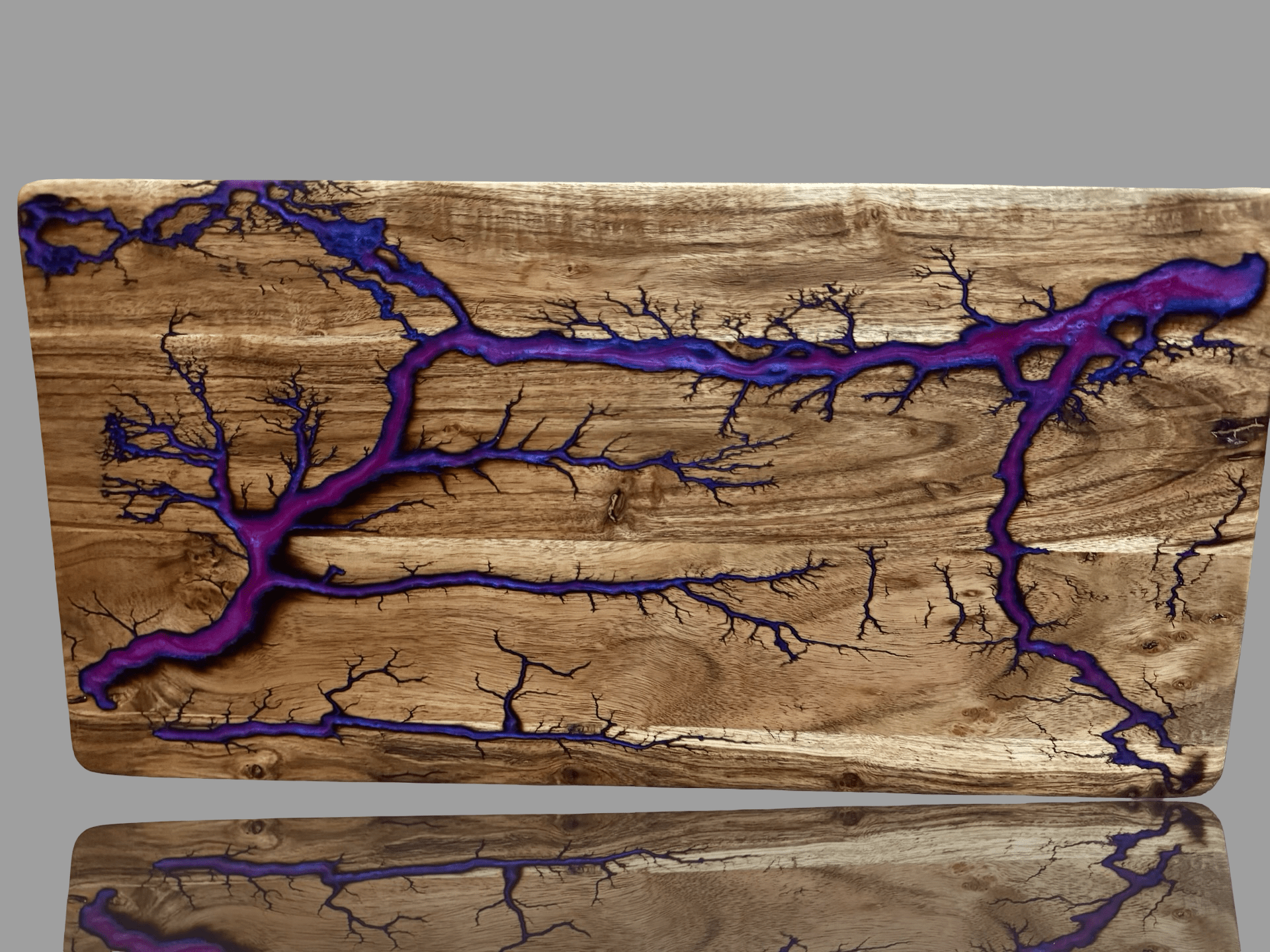 Resin timber serving board by Fractal Flow Designs. Australian-made hardwood with bold resin accents and fractal burning, ideal for cheese boards, grazing platters, charcuterie spreads, or as a premium wedding and housewarming gift