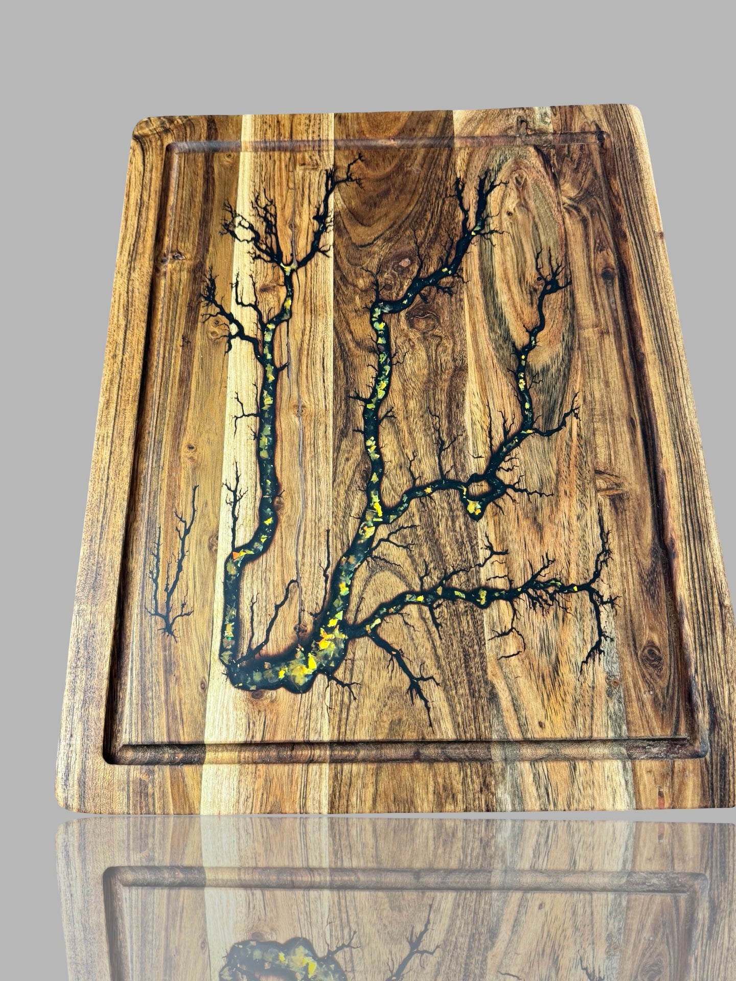 Australian-made resin and timber chopping board with gold fractal burning art by Fractal Flow Designs — sustainable hardwood and gold resin accents.