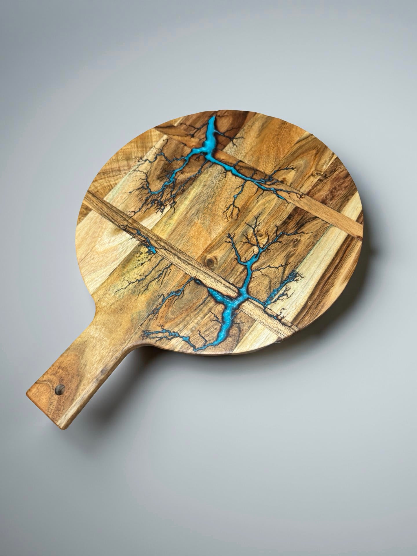 Handcrafted acacia round cheese board lagoon blue resin highlight grazing paddle east gippsland