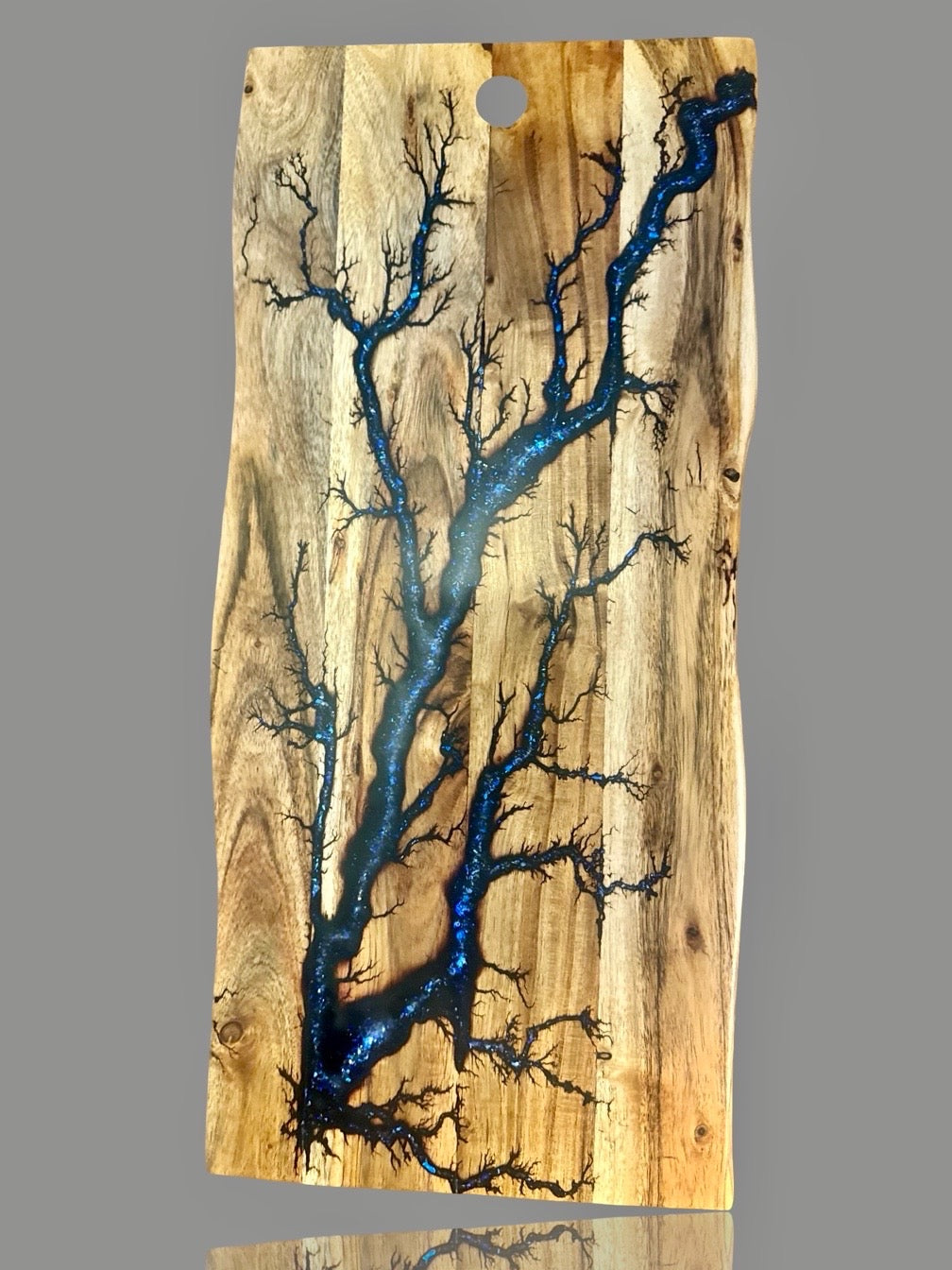 Fractal Flow Designs live edge board featuring resin inlay and natural timber character
