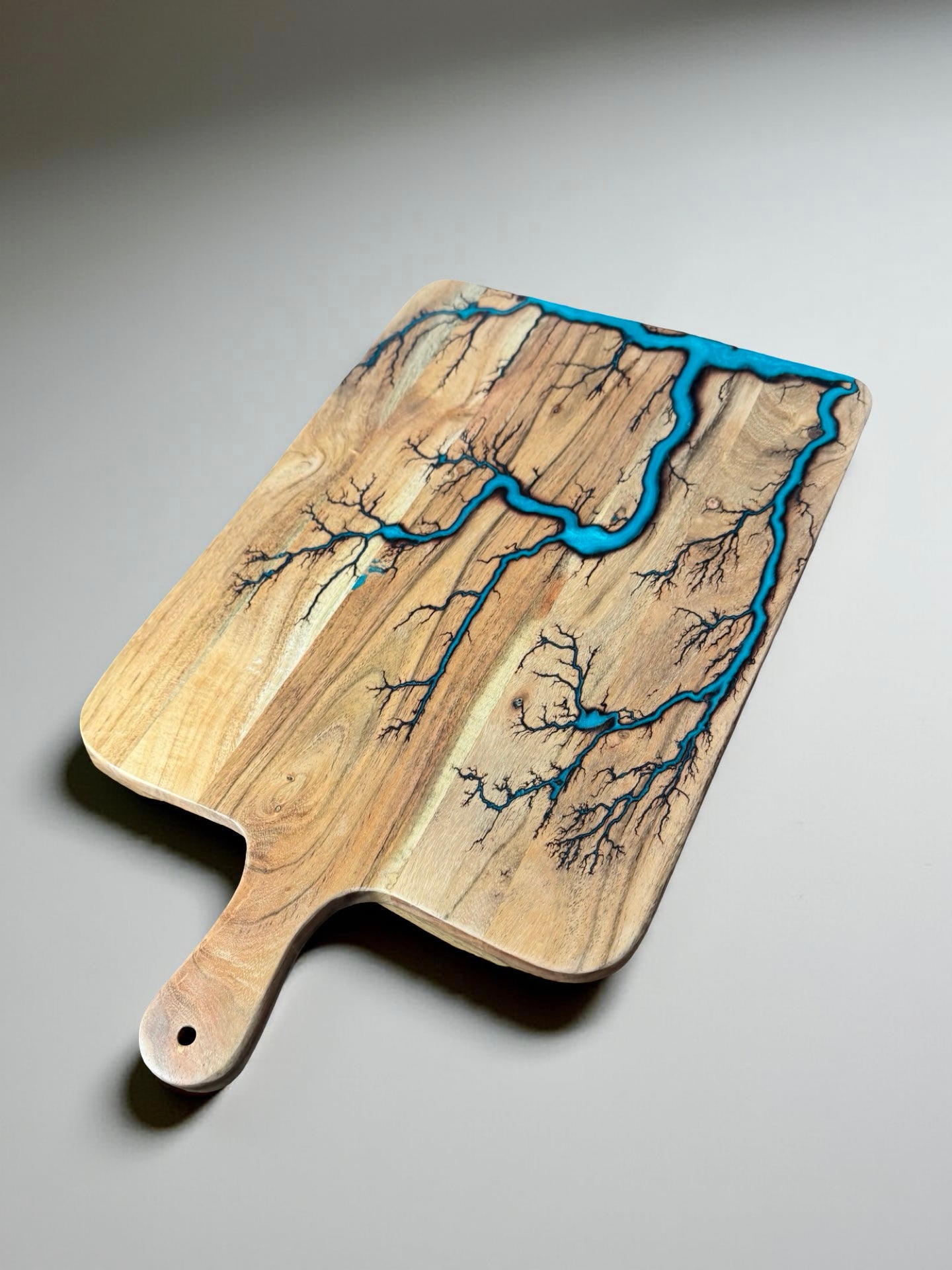 Lagoon blue resin large cheese paddle sustainable Australian timber with striking fractal burning