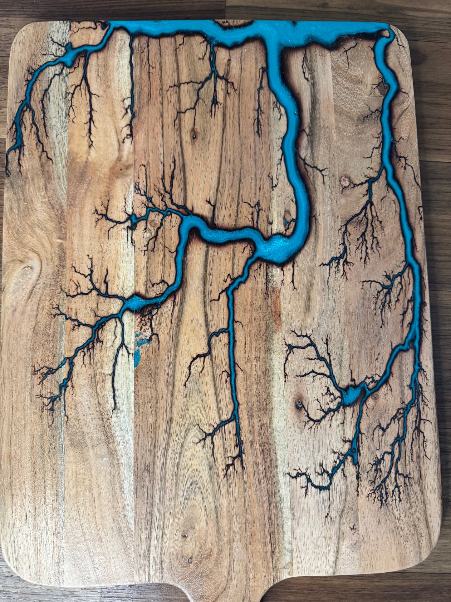 Close up of a Premium large cheese paddle lagoon blue resin boards Australia handcrafted acacia grazing platter