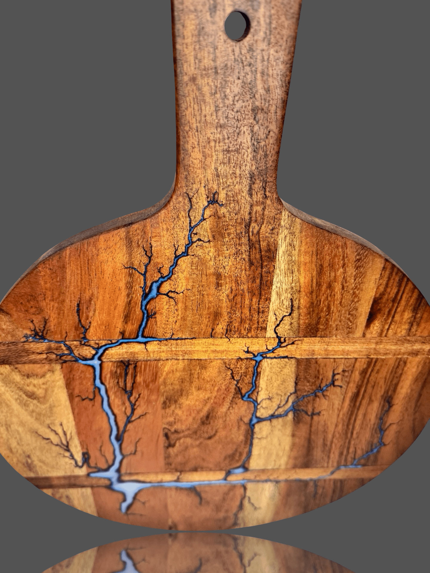 Artisan round resin cheese paddle board by Fractal Flow Designs – unique Australian hardwood serving platter with fractal burning, ideal for gourmet entertaining.