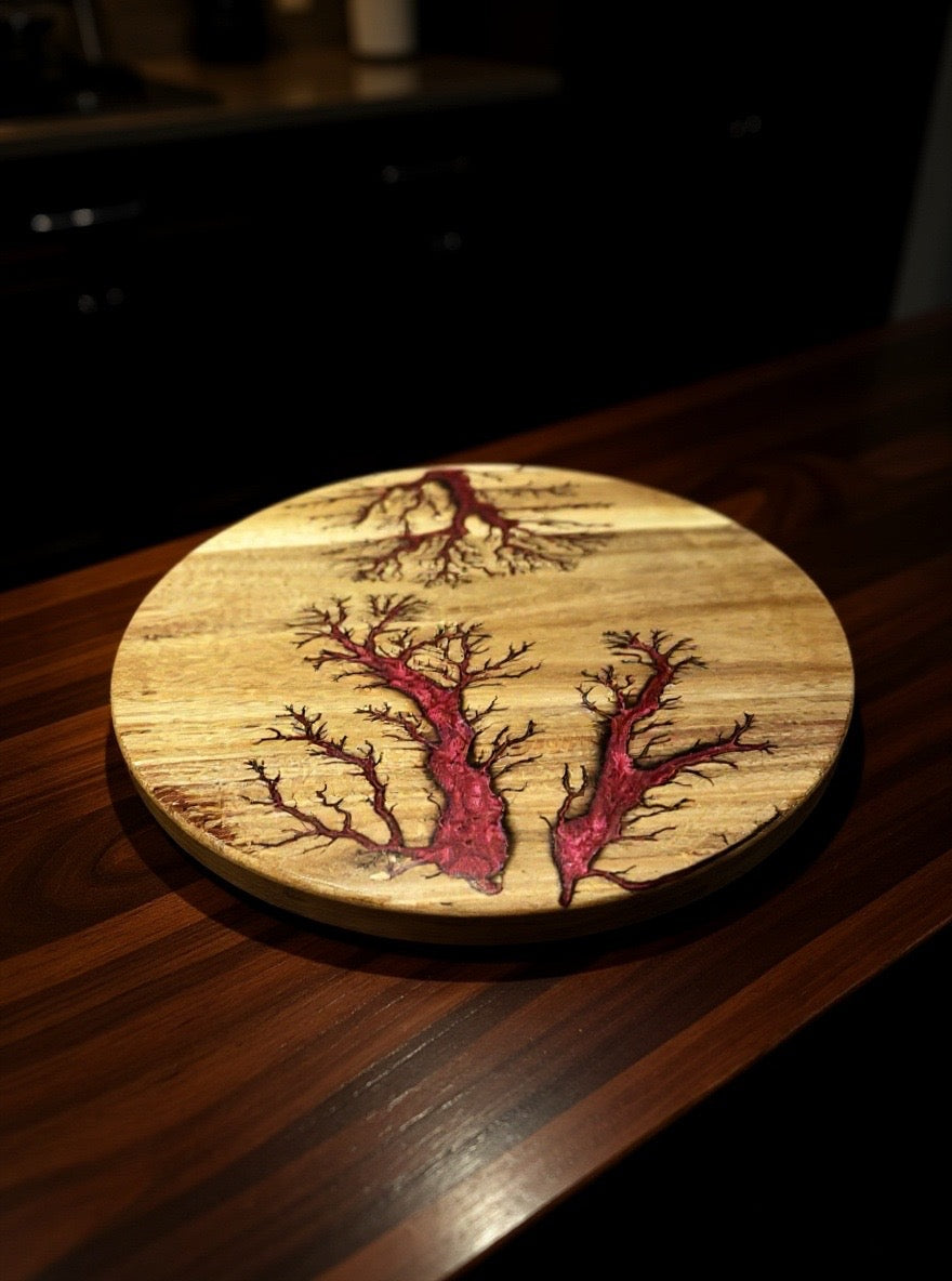 Luxury red resin Lazy Susan 400mm diameter glowing under moody lighting, displayed as centrepiece on timber dining table, handcrafted Australian wood design by Fractal Flow Designs, premium entertaining piece East Gippsland