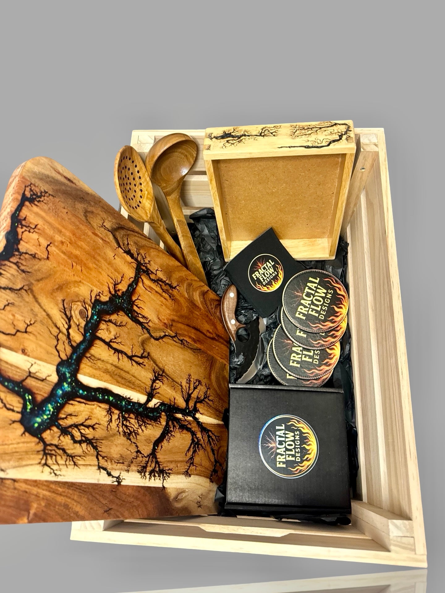 Handcrafted resin gift hamper from Bairnsdale featuring resin cheese board paddle, serving platter, coasters, and premium board care kit