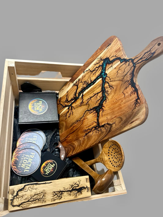 Premium resin gift hamper with serving paddle, forged cheese knife, fractal flow designs coasters and delux wax-and-oil care kit