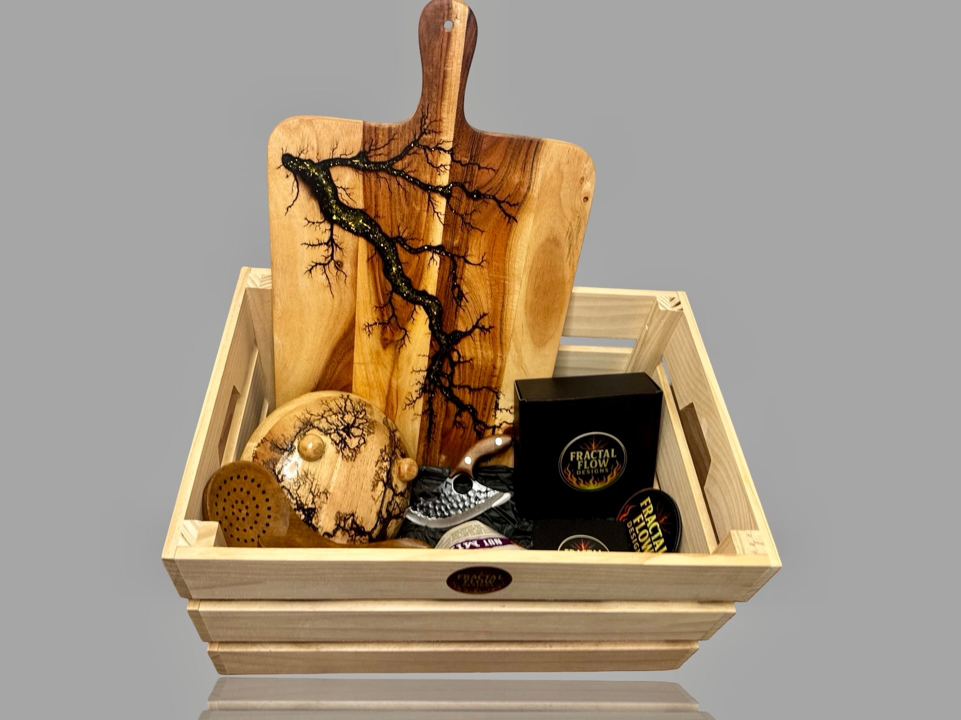 Premium resin board gift box with handcrafted herringbone board, forged cleaver, resin cheese paddle, coasters, and care kit by Fractal Flow Designs
