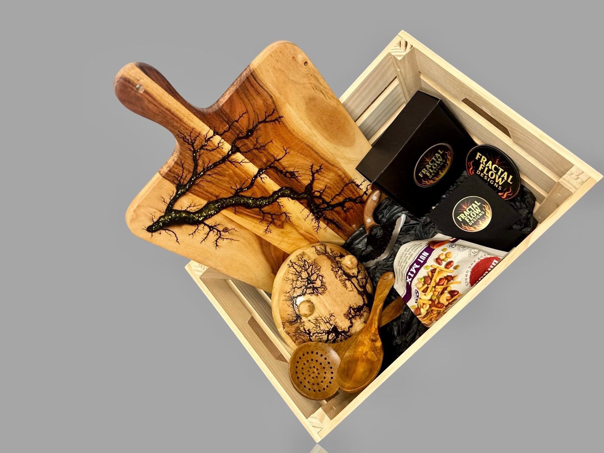 Australian-made luxury gift hamper including resin serving board, cheese accessories, board care kit, and timber coasters, ideal for weddings or birthdays