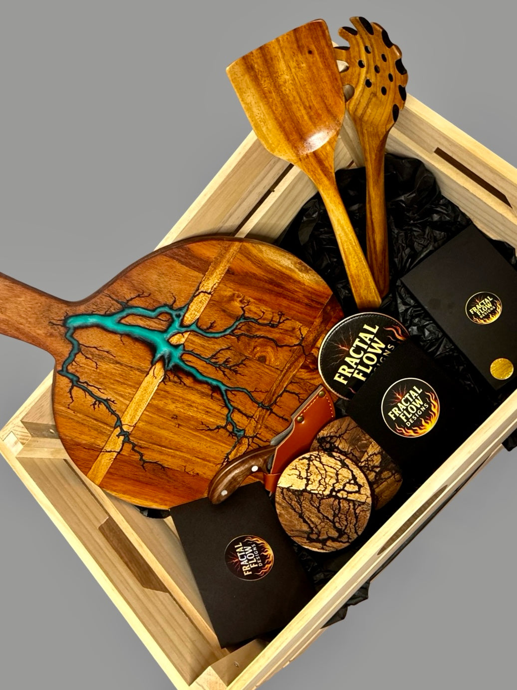 Fractal burnt timber coasters with resin cheese board and knives, deluxe entertaining gift box with stubby holder and teak utensils, Australian-made.
