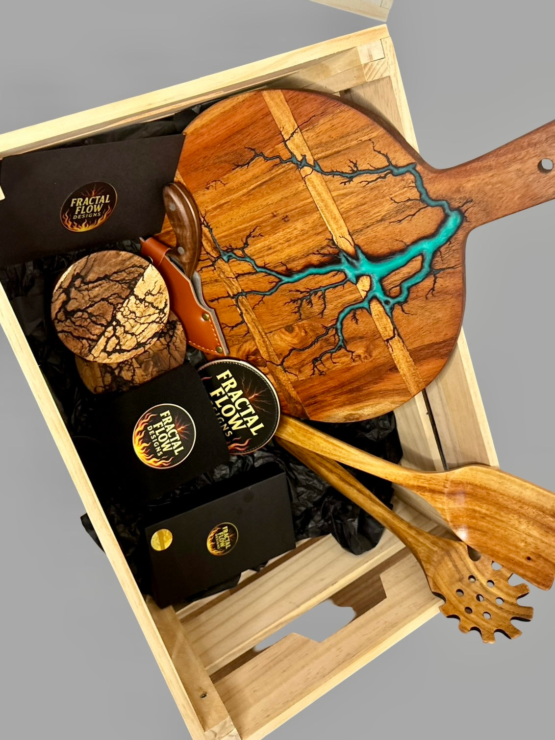 Luxury grazing and cheese board gift box from Fractal Flow Designs with resin timber board, knives, stubby holder, and coasters, ships Australia-wide.