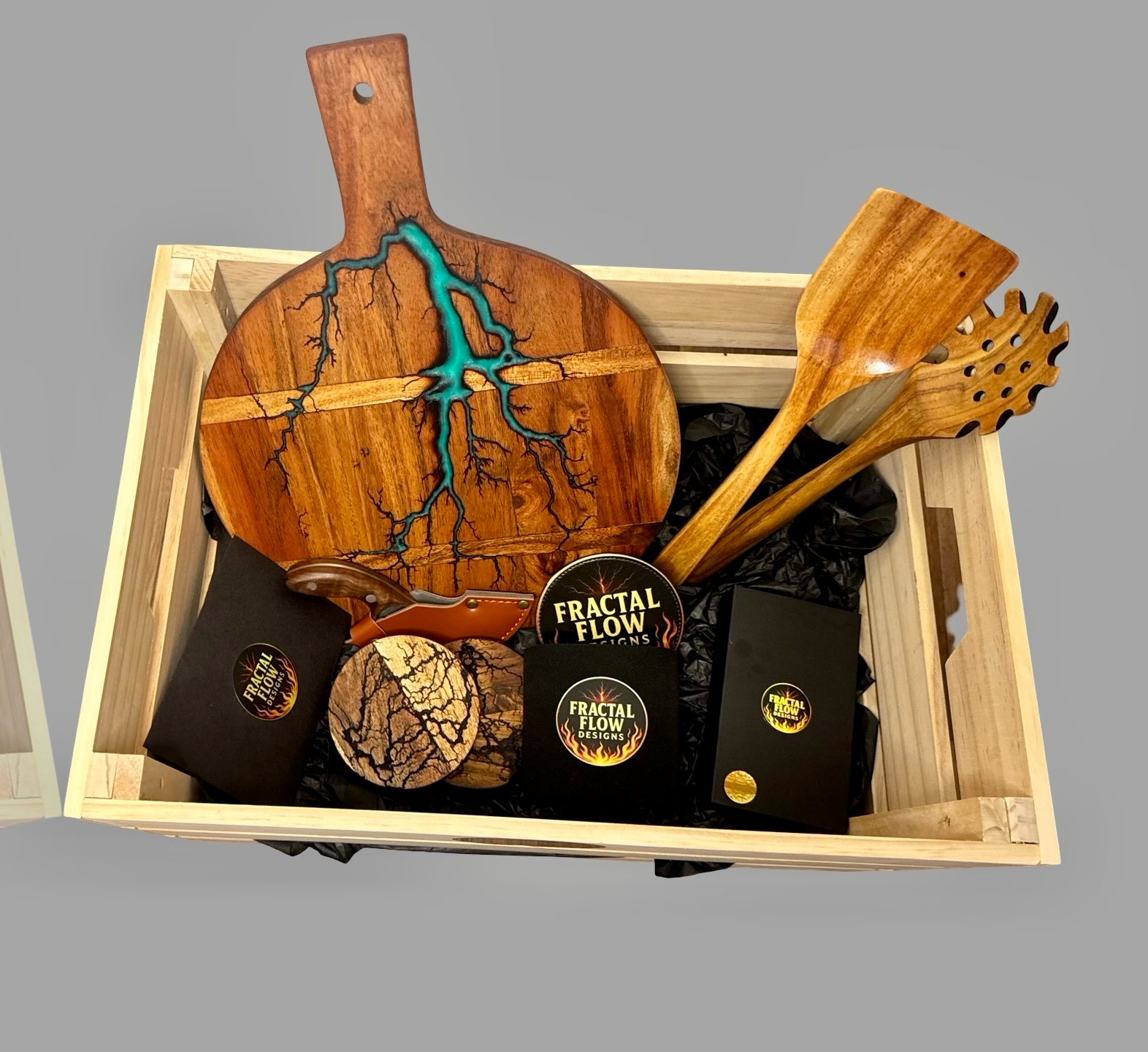 Handcrafted resin cheese board deluxe set including cheese knives, coasters, stubby holder, and teak serving utensils, artisan gift box made in Australia.