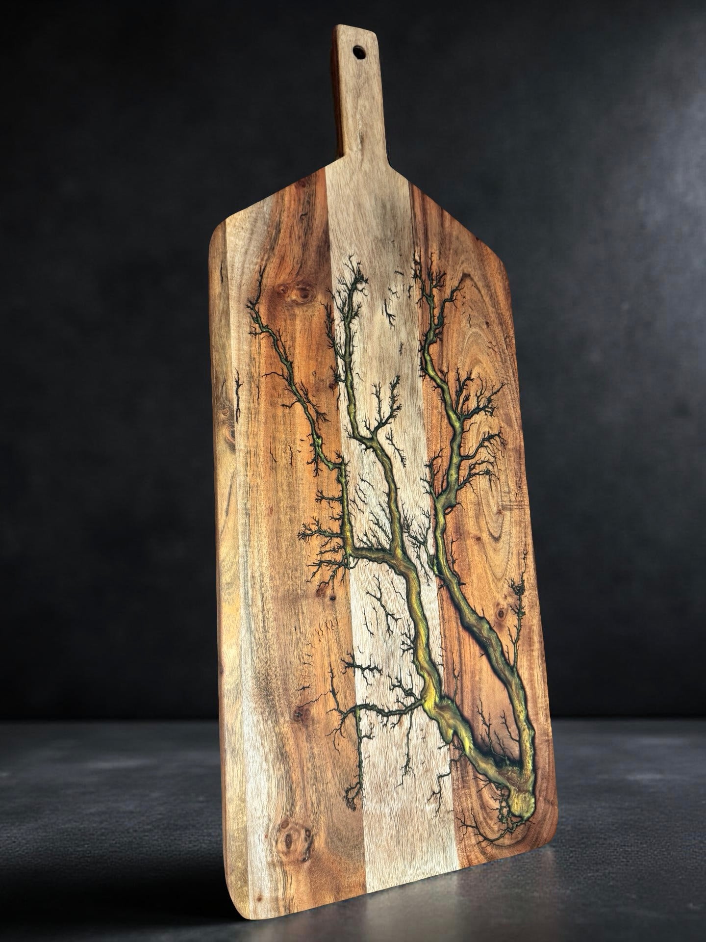 Large resin serving paddle board showcasing artisan craftsmanship and food grade materials