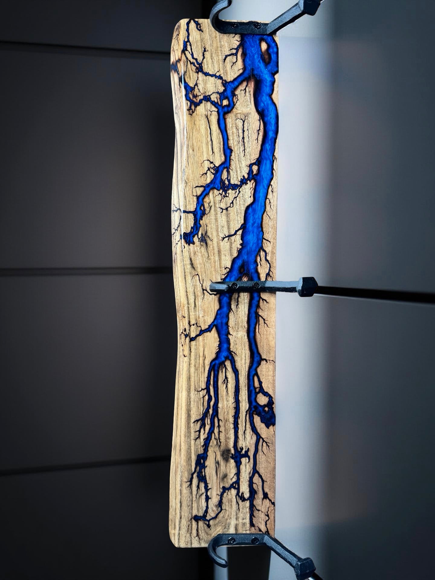 Blue resin coat rack on Australian hardwood, bold modern décor piece