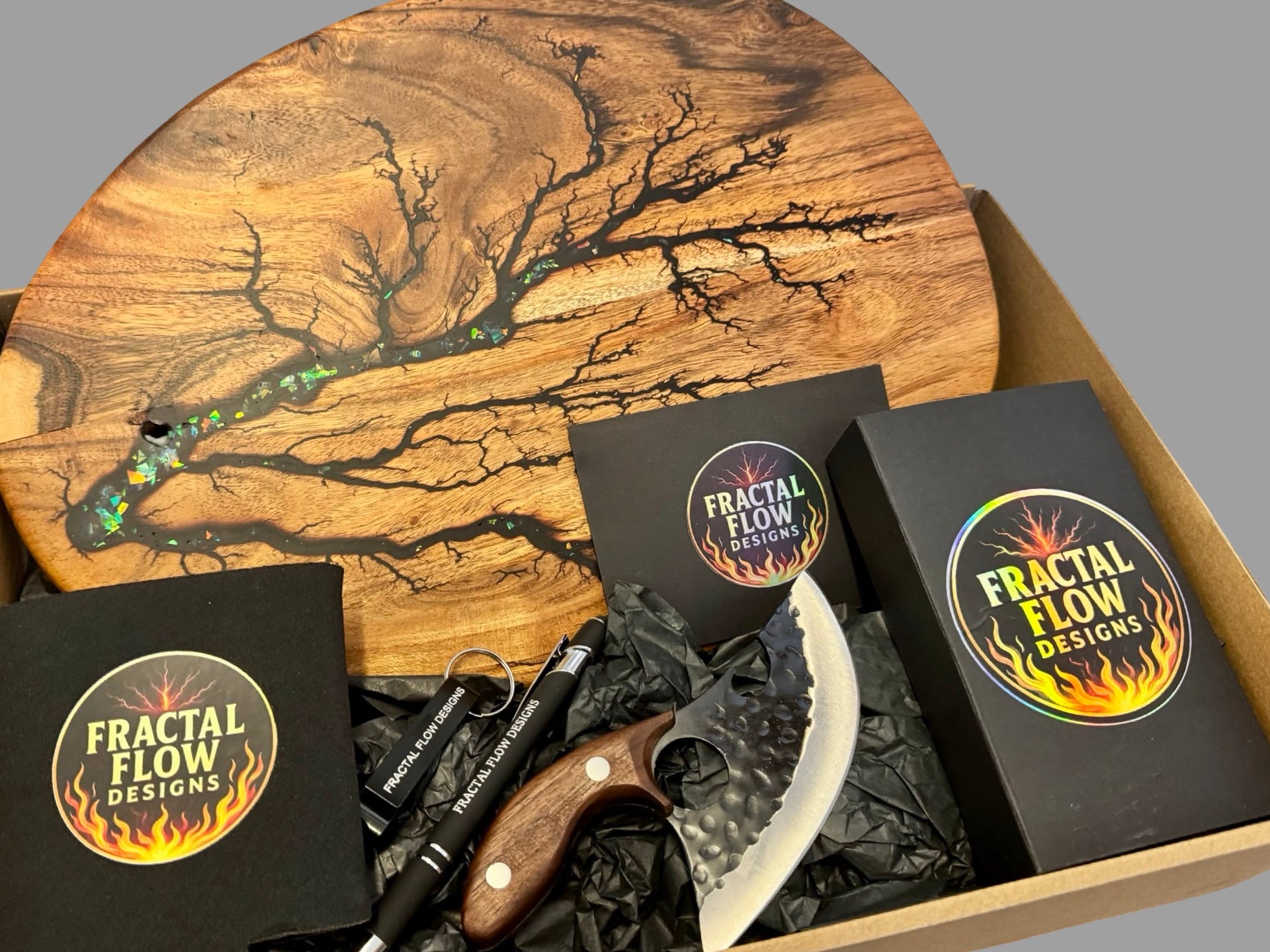 Handmade Australian resin board gift box from Fractal Flow Designs. Includes grazing or cheese board with oil and wax care kit, shipped Australia-wide. Ideal housewarming, birthday, or anniversary present.
