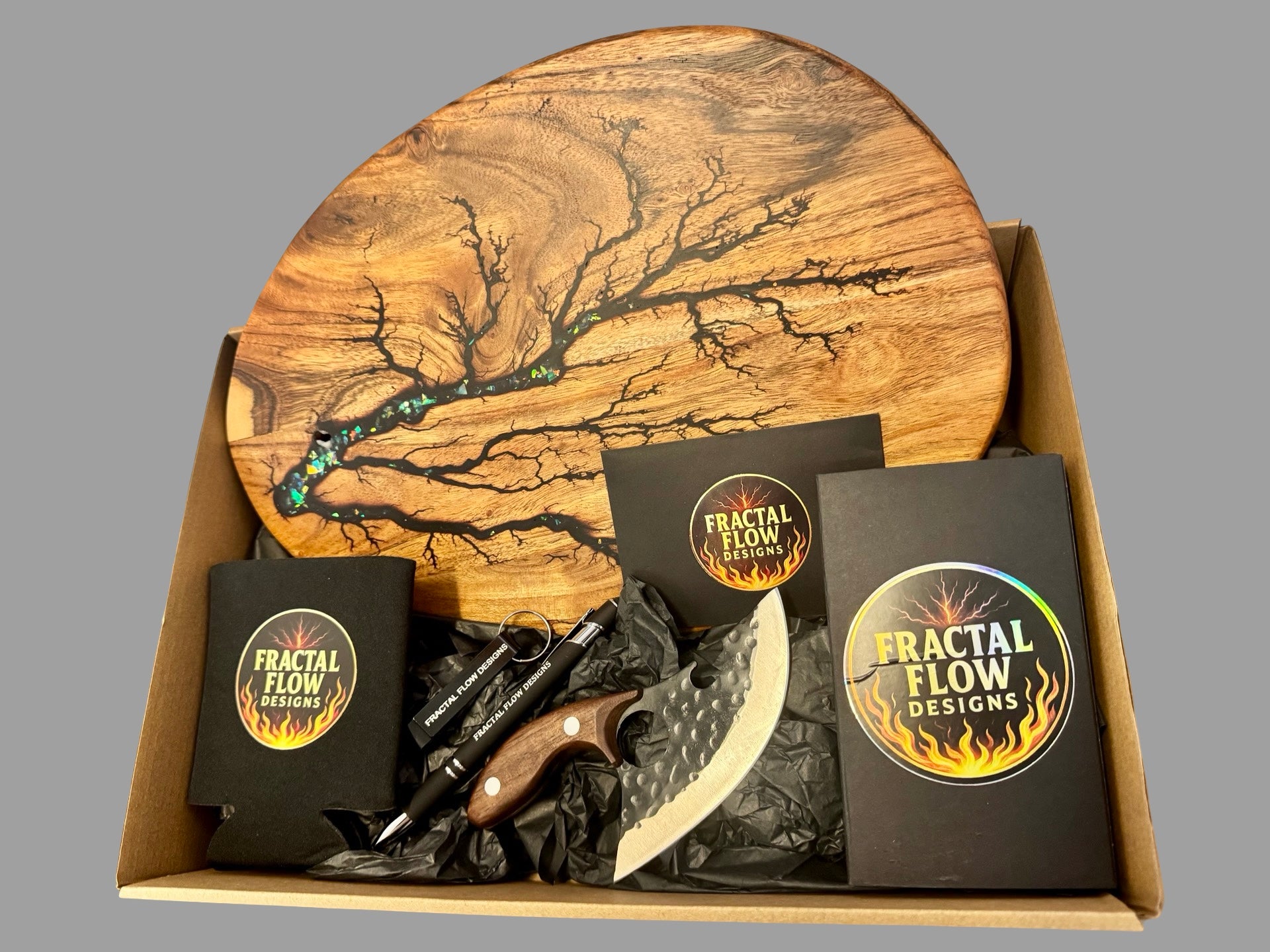 Premium resin gift hamper by Fractal Flow Designs featuring artisan timber boards and care accessories. Crafted in Bairnsdale, Victoria and designed for weddings, anniversaries, and luxury home gifts