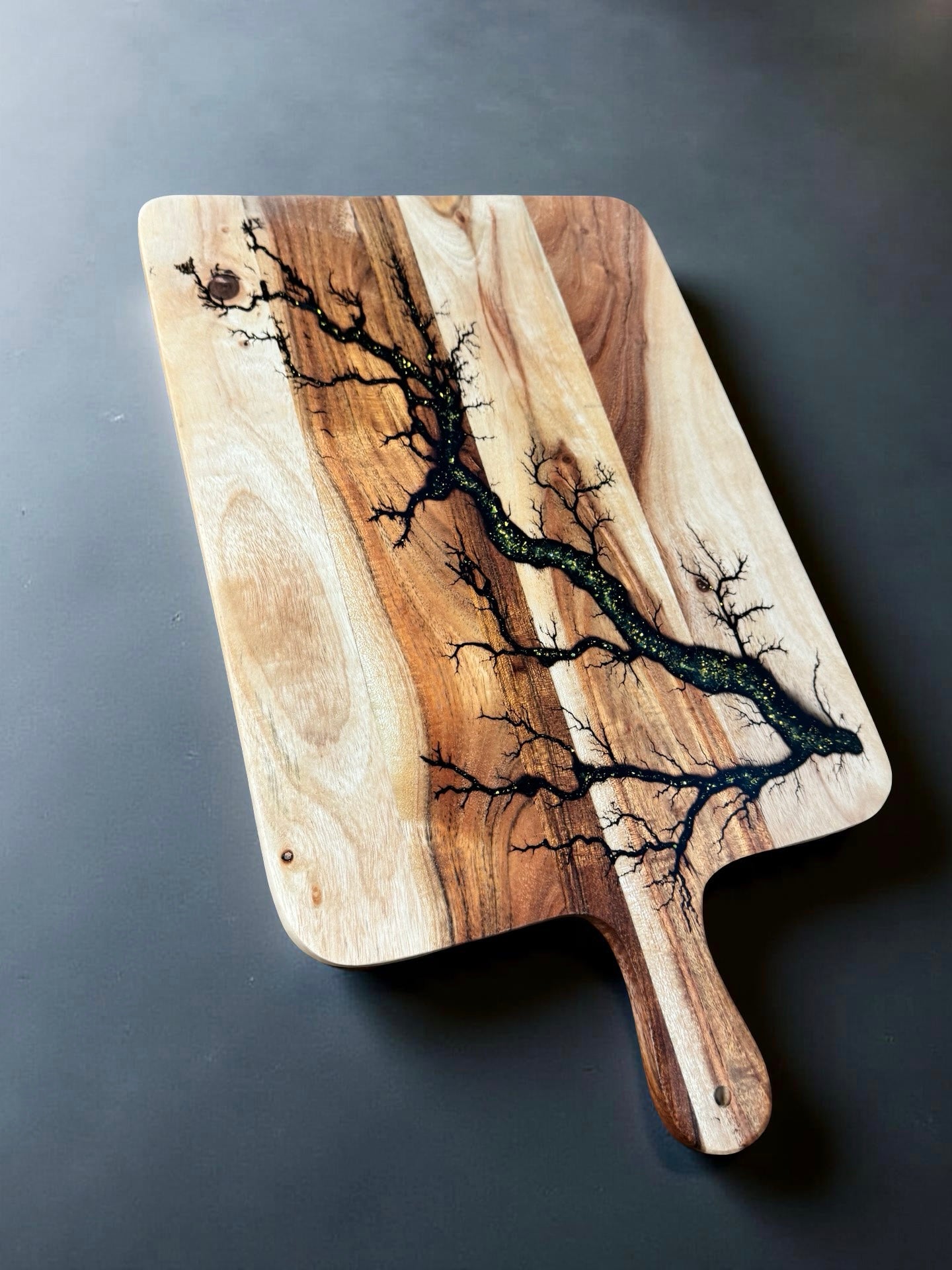 Australian made paddle board with shimmering gold sparkle inlay and artisan fractal burning details