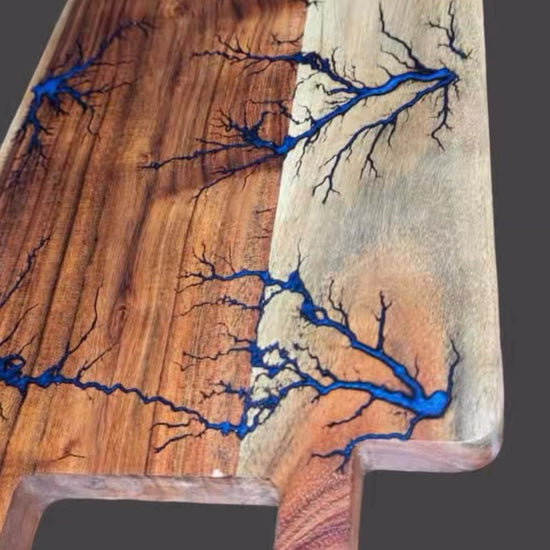 Fractal Flow Designs charcuterie board – handcrafted from premium Australian hardwood with striking resin inlays and fractal burning. A luxury artisan serving platter for cheese, grazing, and entertaining. Perfect Australian-made gift for weddings, anniversaries, birthdays, housewarmings, and corporate events. Unique timber resin board, made in Bairnsdale Victoria.