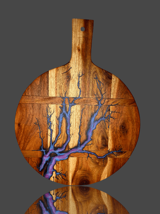 Fractal Flow Designs premium round cheese paddle board made from Australian hardwood with resin artistry. Australian resin boards ideal for weddings, anniversaries, and housewarming gifts.