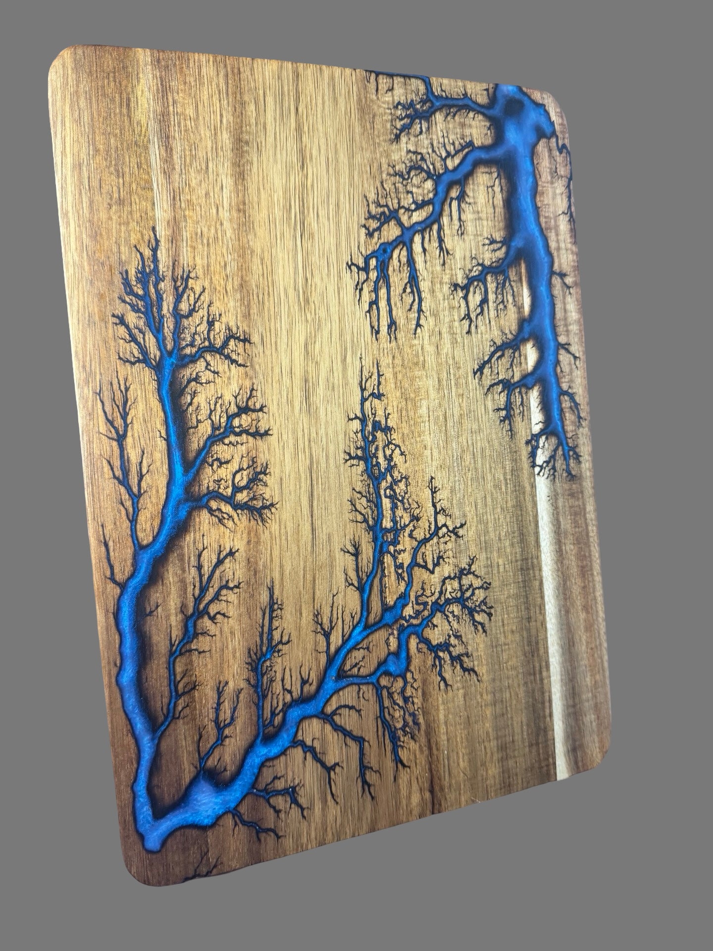 Iridescent Blue Resin art cutting board designed and made in Australia. Fractal Flow Designs blends luxury resin with premium timber for a show-stopping kitchen or serving piece