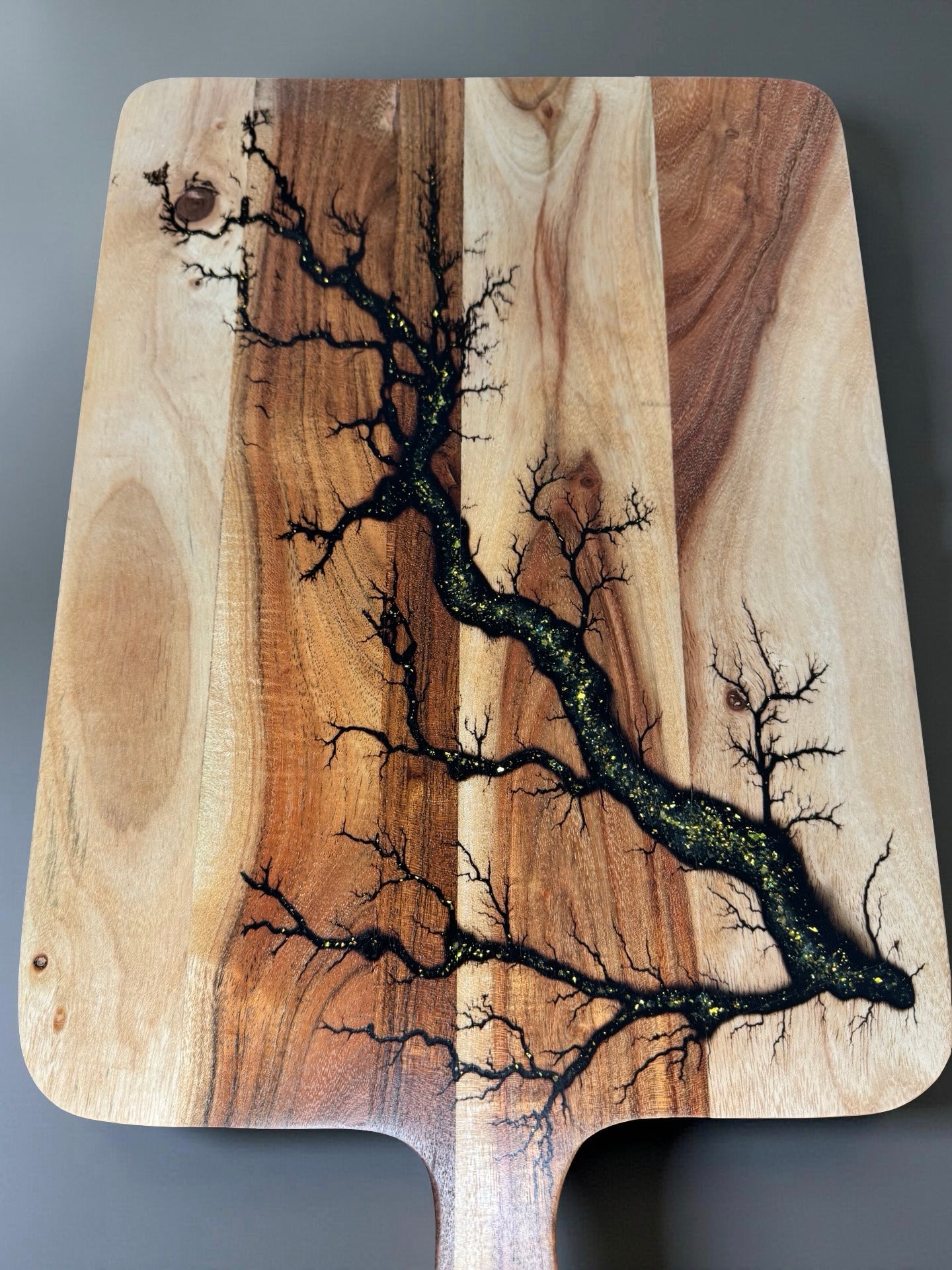 Gold sparkle resin charcuterie paddle board crafted with electric fractal burn artistry Australia wide