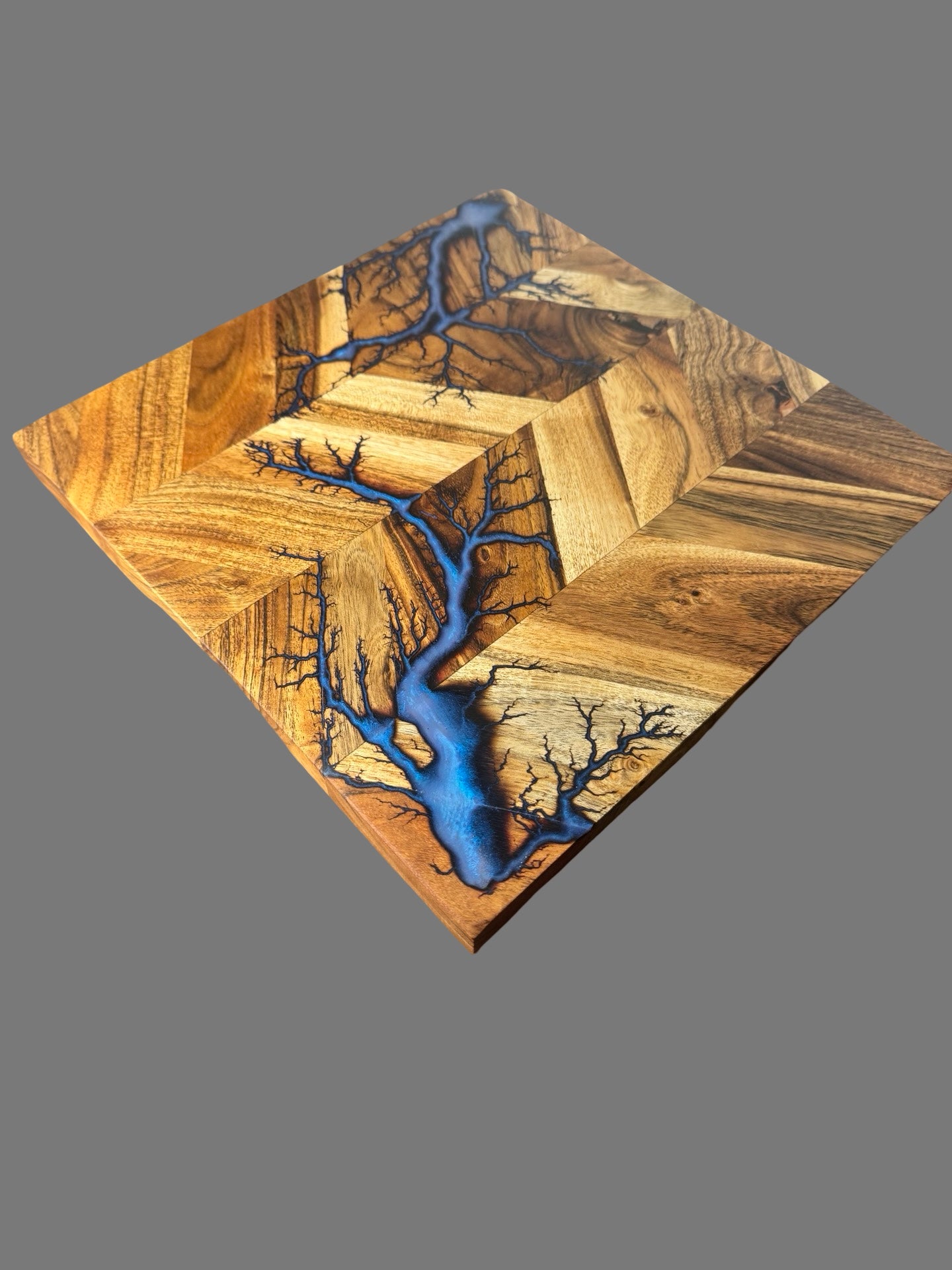 Handcrafted timber chopping board featuring bold resin accents. Australian-made by Fractal Flow Designs — durable, food-safe, and perfect as a luxury kitchen or housewarming gift