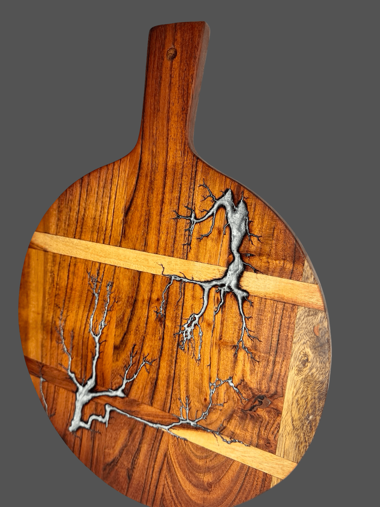 Round resin cheese paddle board styled with gourmet cheeses, crackers, and grapes – handcrafted Australian timber platter by Fractal Flow Designs, perfect for grazing nights and gifting.