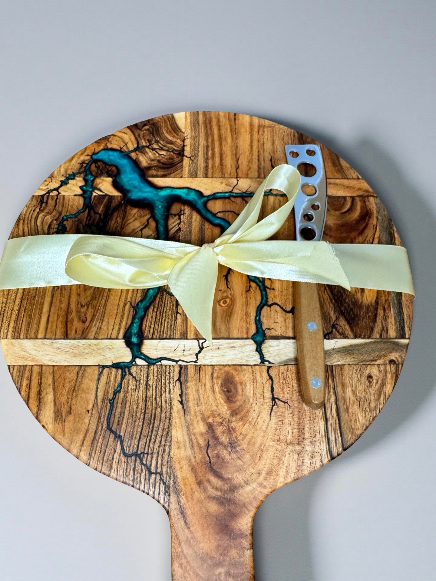 Handcrafted acacia round resin cheese board featuring fractal burning art with gourmet knife