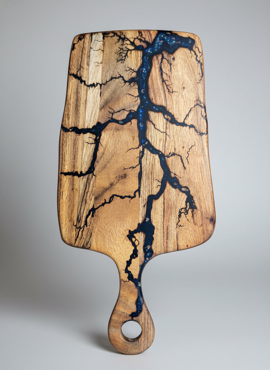 Handcrafted resin cheese paddle board from Bairnsdale, Victoria. Fractal Flow Designs blends timber and resin for a premium grazing board shipped Australia-wide.