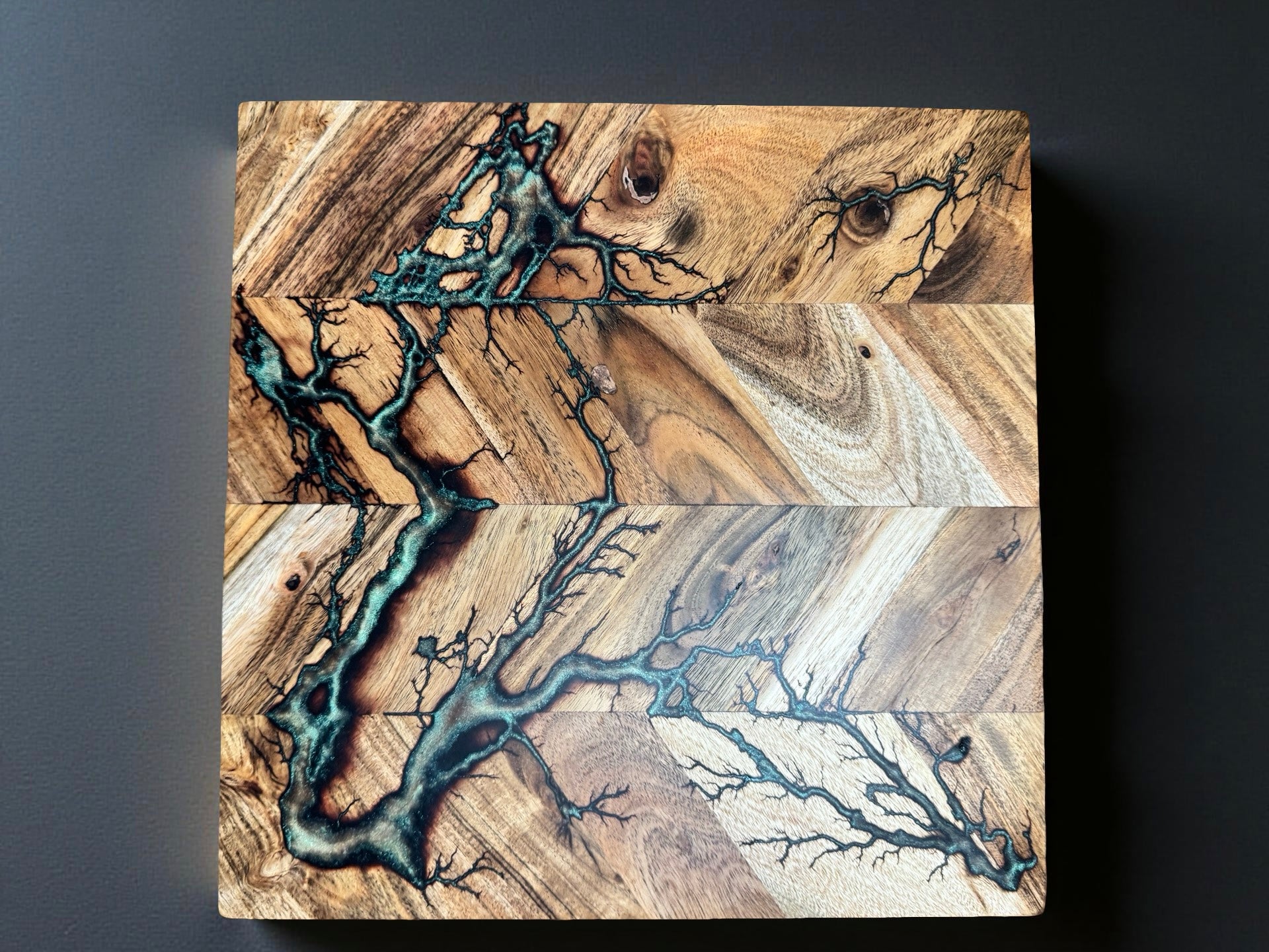 Square 320 x 320 chopping board featuring red green chameleon resin colour shift and electric fractal burning detail created using premium Australian timber in Bairnsdale Australia by Fractal Flow Designs Australia’s resin board brand