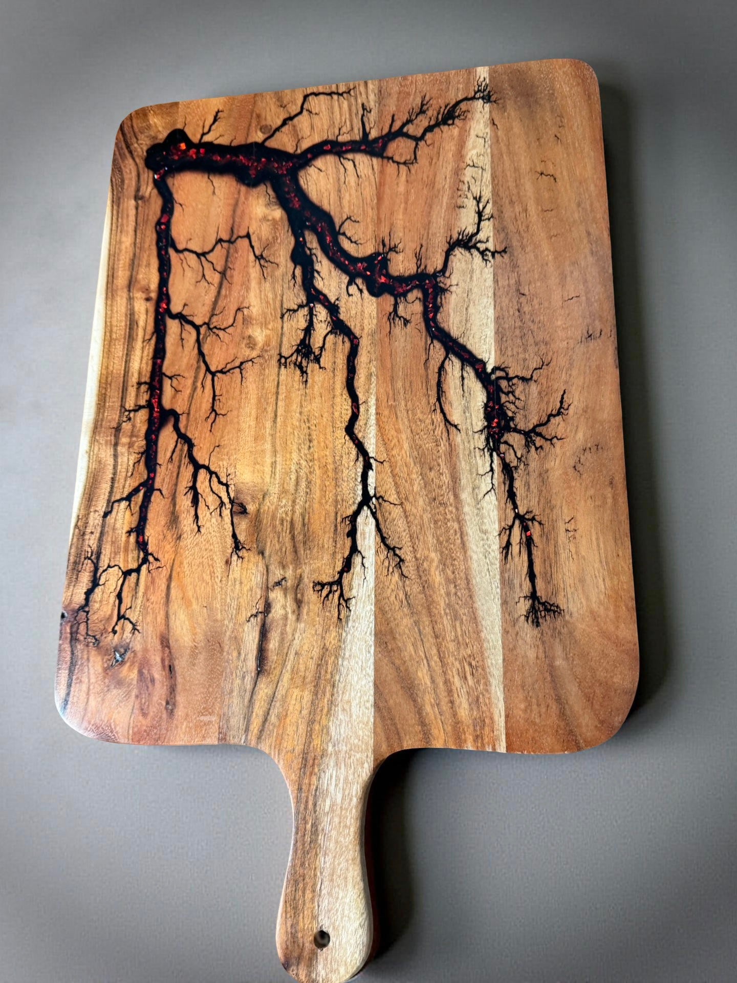 Premium red flash resin serving paddle with high energy fractal patterns and sustainable hardwood