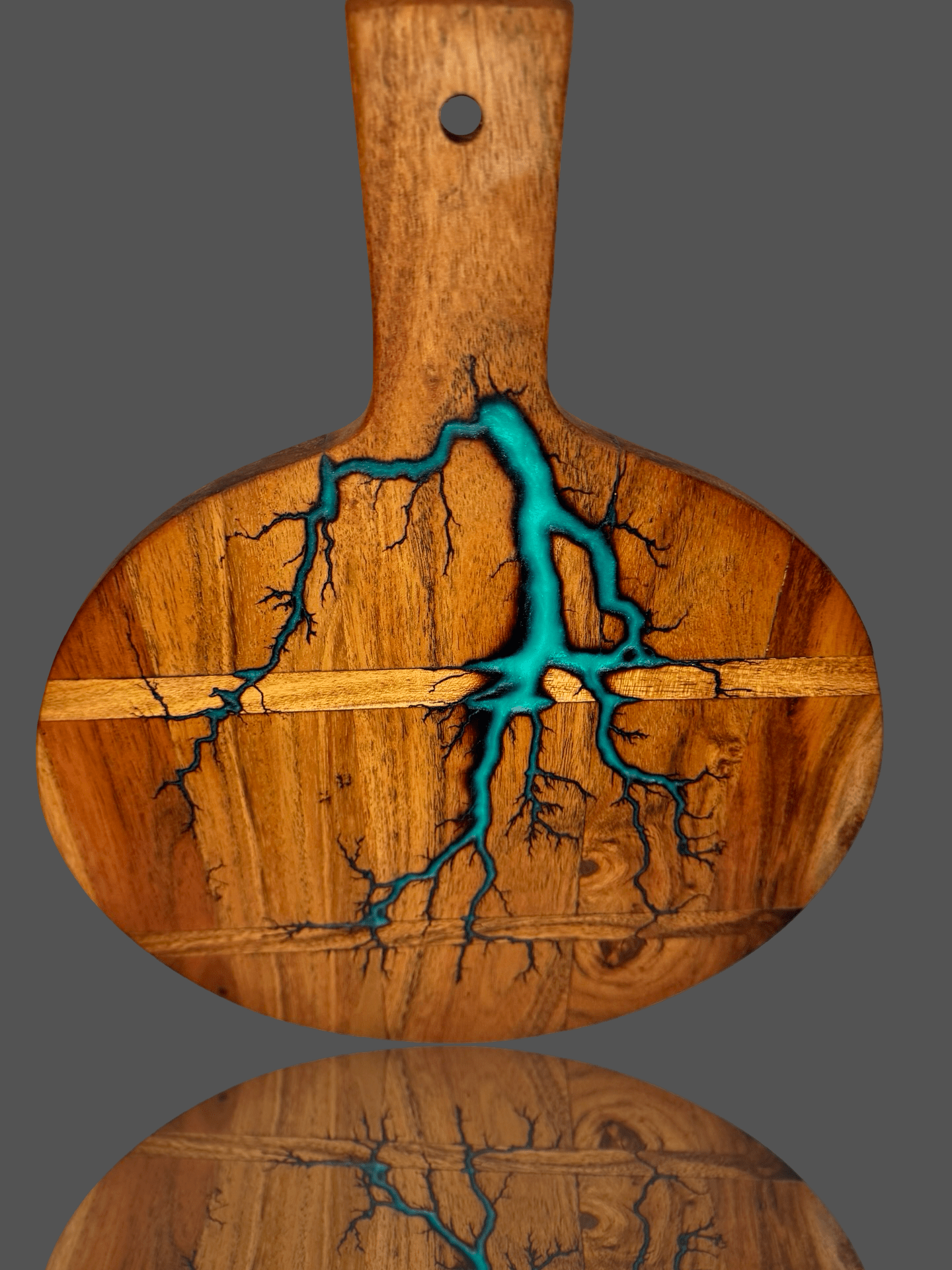 Cheese lovers’ round resin paddle board with crackers, fruit, and wine glasses – handmade Australian timber platter by Fractal Flow Designs, styled for grazing spreads, weddings, and housewarming events.