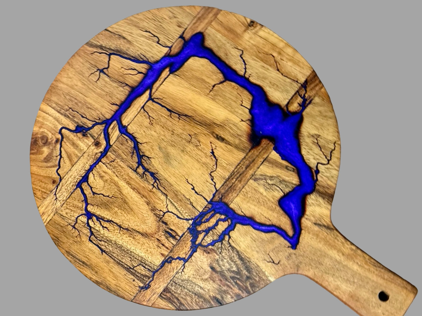 Handcrafted round cheese board with resin art, part of the Australian resin boards collection