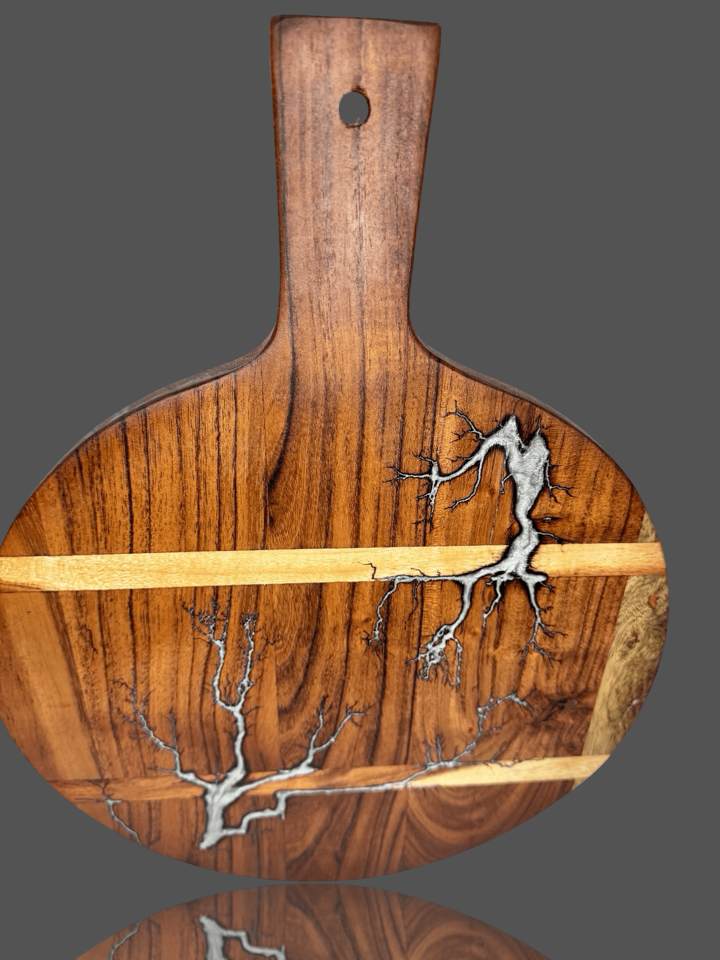 Australian Round resin paddle board set on dining table with wine glasses and grazing platter – handcrafted in Bairnsdale Victoria, perfect for cheese lovers and premium occasions.