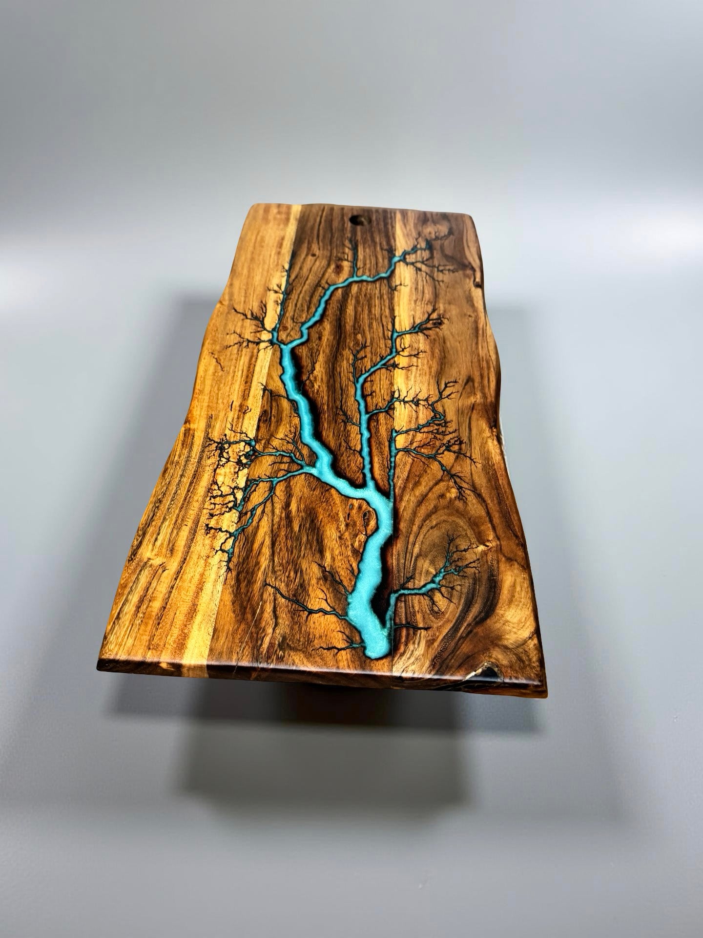 Live edge board teal resin art with electric lightning strike burn design, premium grazing board Australia